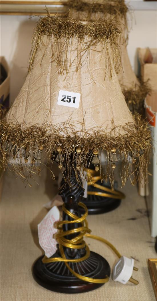 A pair of bronzed metal table lamps, with beige shades overall height 43cm